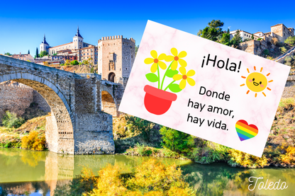 スペインのトレド風景とスペイン語文章の背景画像内にステッカー商品がある。